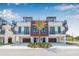 Modern townhomes boasting rooftop decks, spiral staircases, covered parking, and stylish wood and white facade at 460 87Th Avenue North, St Petersburg, FL 33702