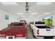 Spacious garage featuring room for multiple cars, overhead lighting, a projection screen, and ample space at 460 87Th Avenue North, St Petersburg, FL 33702