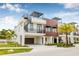 View of the townhome featuring a spiral staircase, rooftop deck, and wood paneling at 484 87Th Avenue North, St Petersburg, FL 33702