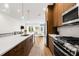 Beautiful kitchen with wood cabinets, stainless steel appliances and an island open to the living space at 484 87Th Avenue North, St Petersburg, FL 33702
