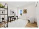 Bright and airy office space featuring hardwood floors, a large desk, and modern artwork at 484 87Th Avenue North, St Petersburg, FL 33702