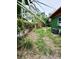 Landscaped backyard with a lush green lawn at 5209 10Th S Ave, Gulfport, FL 33707