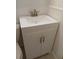 Close up of a white vanity with a square sink, brushed nickel faucet, and painted white cabinet at 5209 10Th S Ave, Gulfport, FL 33707