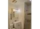 Bathroom with a white vanity, medicine cabinet, and shower with glass doors at 5209 10Th S Ave, Gulfport, FL 33707