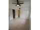 Spacious bedroom with tile flooring, a ceiling fan, and multiple closets for storage at 5209 10Th S Ave, Gulfport, FL 33707