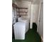 Laundry room with a washing machine, dryer, and shelves for storage at 5209 10Th S Ave, Gulfport, FL 33707