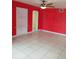 View of neutral tiled floor in living room with shelf and an archway at 5209 10Th S Ave, Gulfport, FL 33707