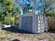 A simple storage shed with access ladder, nestled in a tree-shaded yard and providing storage space at 5209 10Th S Ave, Gulfport, FL 33707