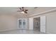 A spacious main bedroom includes a vaulted ceiling, tile floors and glass doors leading to a pool at 5366 Hader Rd, North Port, FL 34288