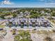 New construction homes with rooftop patios, green trees, and city skyline at 8631 5Th Street North, St Petersburg, FL 33702