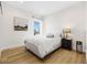 Bedroom featuring neutral decor, wood floors, and a window view at 8631 5Th Street North, St Petersburg, FL 33702