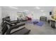 Well-equipped garage space with exercise equipment and parking for two cars at 8631 5Th Street North, St Petersburg, FL 33702