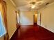 Bedroom featuring hardwood floors, ceiling fan, and natural lighting at 2254 Chianti Pl # 68, Palm Harbor, FL 34683