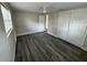 This bedroom has modern flooring and a closet with sliding doors for efficient storage at 3341 Wiltshire Dr, Holiday, FL 34691