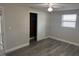 Bedroom with modern flooring, a ceiling fan, and closet with sliding doors at 3341 Wiltshire Dr, Holiday, FL 34691