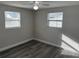 Bedroom with modern flooring and two windows that offer natural light at 3341 Wiltshire Dr, Holiday, FL 34691
