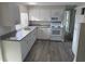 Kitchen featuring modern appliances, white cabinetry, and durable countertop at 3341 Wiltshire Dr, Holiday, FL 34691