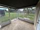 Screened porch with concrete floor and view of fenced backyard at 3341 Wiltshire Dr, Holiday, FL 34691