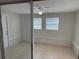 Well-lit sunroom with tile flooring, multiple windows, and glass sliding door at 3341 Wiltshire Dr, Holiday, FL 34691