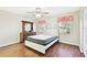 Bedroom with hardwood floors, neutral paint, and large windows for natural light at 37401 Wedgewood Dr, Zephyrhills, FL 33542
