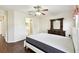 Bedroom with hardwood floors and ensuite bathroom at 37401 Wedgewood Dr, Zephyrhills, FL 33542