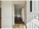 Inviting entryway leading to a bright living space with hardwood floors and neutral walls at 37401 Wedgewood Dr, Zephyrhills, FL 33542