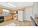 Well-lit kitchen with white appliances and ample cabinet space at 37401 Wedgewood Dr, Zephyrhills, FL 33542