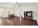 Open-concept living room featuring hardwood floors, a ceiling fan, and ample natural light at 37401 Wedgewood Dr, Zephyrhills, FL 33542