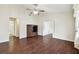 Open living room with hardwood floors, high ceilings, and a ceiling fan at 37401 Wedgewood Dr, Zephyrhills, FL 33542