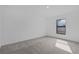 This bedroom features neutral carpet and a window allowing for plenty of natural light at 4294 Danbury St, North Port, FL 34286