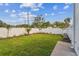Well-manicured backyard with lush grass, landscaping, and a white privacy fence at 441 42Nd Ne Ave, St Petersburg, FL 33703