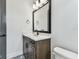 Modern bathroom with dark wood vanity, decorative tile floor at 441 42Nd Ne Ave, St Petersburg, FL 33703