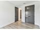 Bedroom with wood floors and stylish gray closet doors and access to other rooms at 441 42Nd Ne Ave, St Petersburg, FL 33703