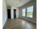 Bright bedroom with hardwood floors and a large window with great natural light at 441 42Nd Ne Ave, St Petersburg, FL 33703
