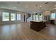 Open-concept kitchen features a large island, stainless steel appliances, and modern lighting at 441 42Nd Ne Ave, St Petersburg, FL 33703