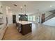Modern kitchen with island, stainless appliances, and hardwood flooring throughout the open space at 441 42Nd Ne Ave, St Petersburg, FL 33703