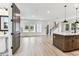 Open-concept living space with lots of natural light, wood-look flooring, and stairs to the second floor at 441 42Nd Ne Ave, St Petersburg, FL 33703