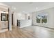 Upstairs living room features modern decor, wood-look flooring, and a bathroom at 441 42Nd Ne Ave, St Petersburg, FL 33703