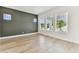 Bright living room with lots of natural light and wood-look flooring with accent wall at 441 42Nd Ne Ave, St Petersburg, FL 33703