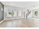 Open living room with three large windows and stairs, allowing for plenty of natural light at 441 42Nd Ne Ave, St Petersburg, FL 33703