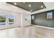 Large primary bedroom featuring a trey ceiling, wood flooring, and shiplap accent wall at 441 42Nd Ne Ave, St Petersburg, FL 33703