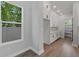 A stylish kitchen pantry featuring white cabinets, wood floors, and ample storage space at 441 42Nd Ne Ave, St Petersburg, FL 33703