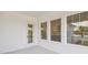 Covered patio with windows showcasing the interior kitchen and outdoor views at 441 42Nd Ne Ave, St Petersburg, FL 33703