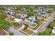 Aerial view of the property showcasing its pool, fenced yard, and neighborhood at 4701 Lodestone Dr, Tampa, FL 33615