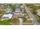 Aerial view of the property showcasing its pool, fenced yard, and street at 4701 Lodestone Dr, Tampa, FL 33615