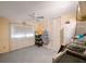 Well-lit bedroom featuring carpet, a ceiling fan, and a closet for ample storage at 4701 Lodestone Dr, Tampa, FL 33615