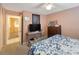 Cozy bedroom with a ceiling fan, comfortable bed, and connected to another room at 4701 Lodestone Dr, Tampa, FL 33615