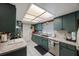 Galley kitchen with ample cabinets and countertop space at 4701 Lodestone Dr, Tampa, FL 33615