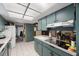 An eat-in kitchen with tile floors and a skylight offers plenty of counter space at 4701 Lodestone Dr, Tampa, FL 33615