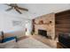 Inviting living room with a brick fireplace and ample space for relaxation and entertainment at 4701 Lodestone Dr, Tampa, FL 33615